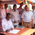 File image of former Tana River Governor Hussein Dado signing documents