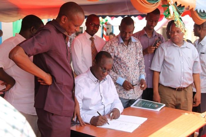 File image of former Tana River Governor Hussein Dado signing documents