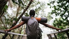 A woman standing on a foot bridge [Image: RF Studio]