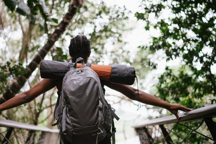 A woman standing on a foot bridge [Image: RF Studio]
