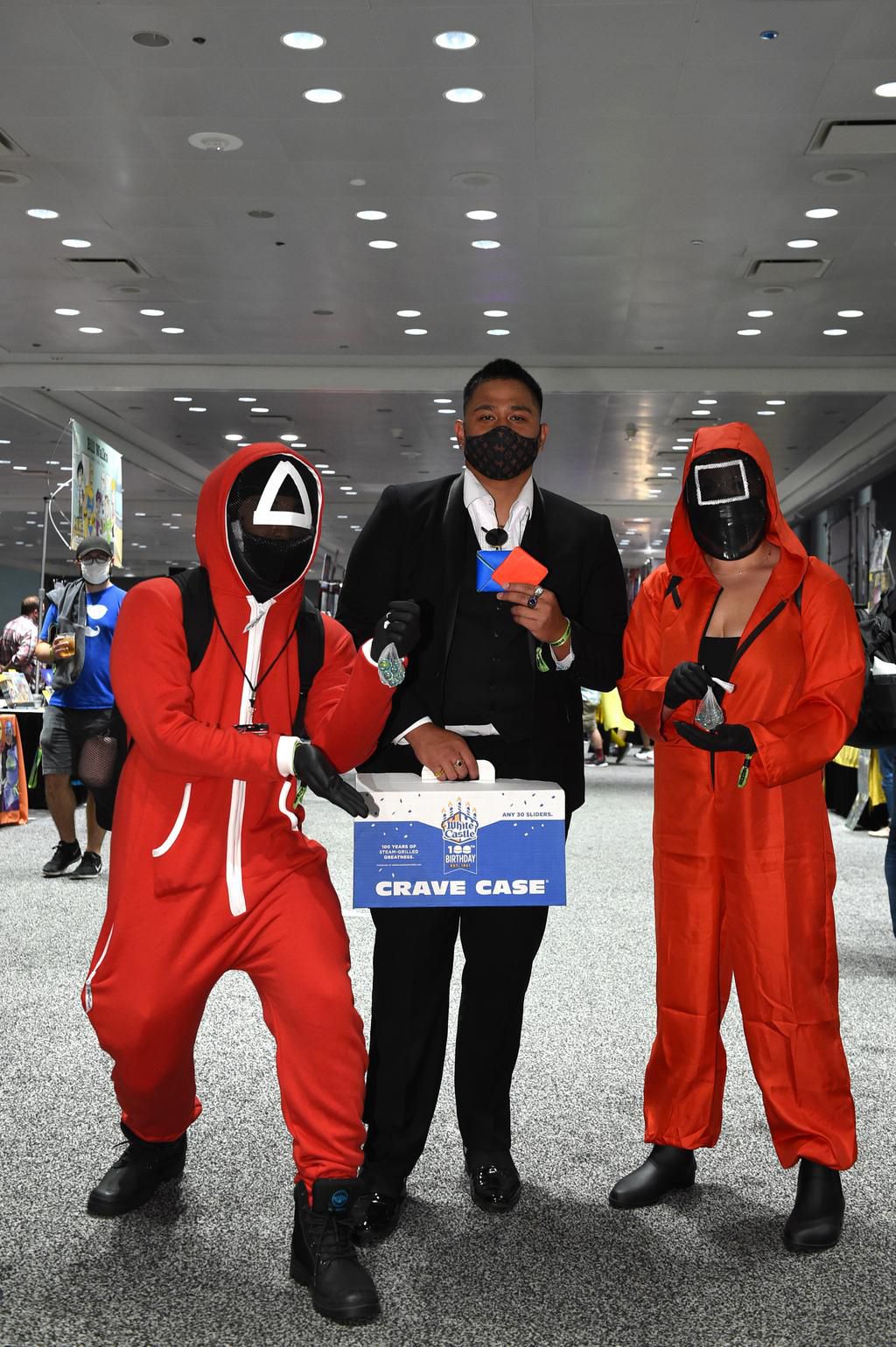 The event's staff wore pink circle, triangle and square costumes to look like the guards in the show's death games.