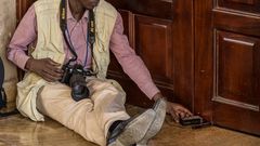 A journalist covering a story during a past event