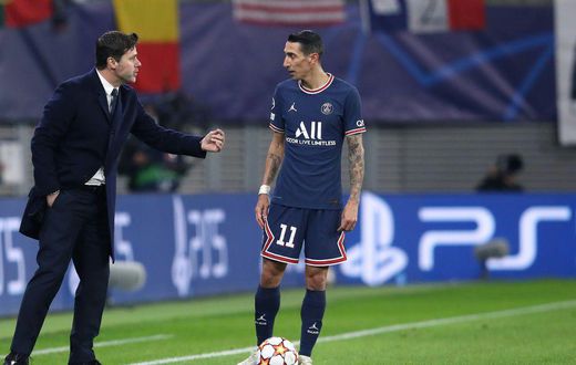 PSG coach Mauricio Pochettino with Angel di Maria during Wednesday's Champions League game against Leipzig