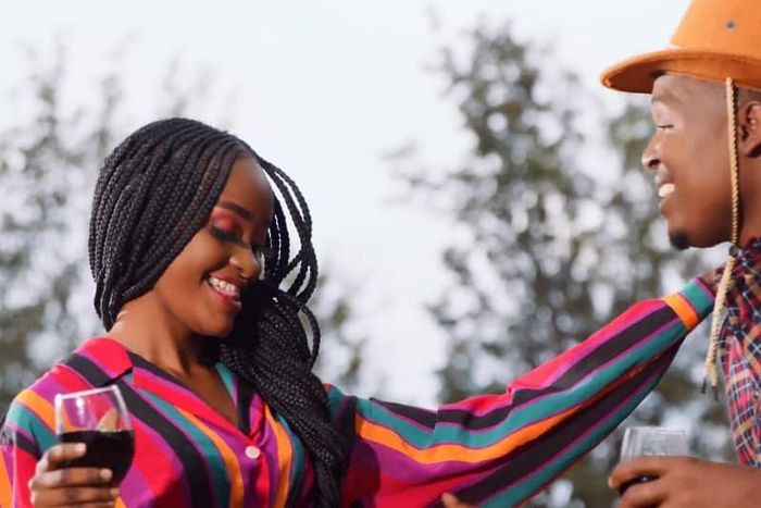 Singer B-Classic and a vixen form his new song Cheza Nawe