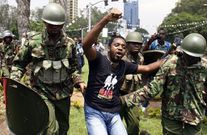 Kenyan activist Boniface Mwangi is arrested during a protest in Nairobi on February 13, 2014. The demonstration entitled "State of the Nation" was held to protest against rising cases of corruption in the government, lack of safety in public places, hi...