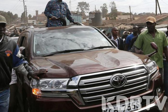 Former Prime Minister Raila Odinga riding in his car