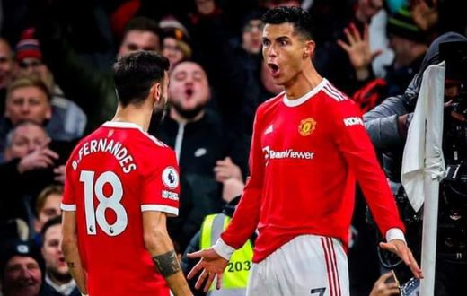 Bruno Fernandes and Cristiano Ronaldo celebrate at Old Trafford on Thursday night.