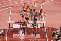 TOKYO, JAPAN - JULY 30: Benjamin Kigen of Team Kenya and Lamecha Girma of Team Ethiopia compete during round one of the Men's 3000m Steeplechase heats on day seven of the Tokyo 2020 Olympic Games at Olympic Stadium on July 30, 2021 in Tokyo, Japan. (Photo by David Ramos/Getty Images)