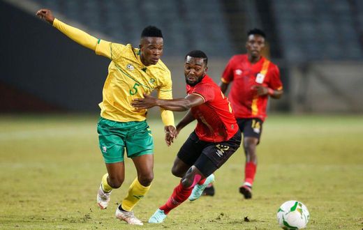 South African Sibusiso Mabiliso (L) and Ugandan Abdu Lumala seek possession during a friendly international in Soweto on Thursday.