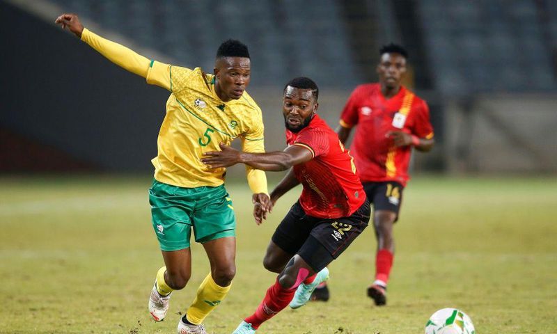 South African Sibusiso Mabiliso (L) and Ugandan Abdu Lumala seek possession during a friendly international in Soweto on Thursday.