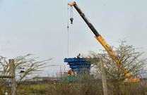 Construction workers on a pillar of the controversial railway line in the Nairobi National Park