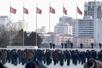 North Korean citizens hold a moment of silence in Pyongyang on Dec. 17, 2021, the 10th anniversary of the death of North Korea's second leader Kim Jong Il. (Photo by Kyodo News via Getty Images)