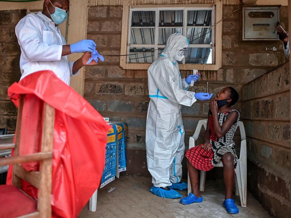 [FILE] A young girl waits to be tested for COVID-19 in Kenya.