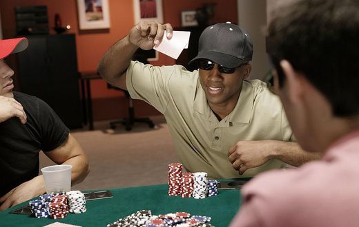 Man throwing cards