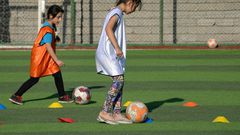 Iraqi girls take part in a football training session at the Bartalla sports club, in the former jihadist stronghold of Bartalla