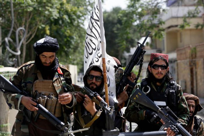 Taliban fighters display their flag on patrol in Kabul, Afghanistan, on Thursday, Aug. 19, 2021.