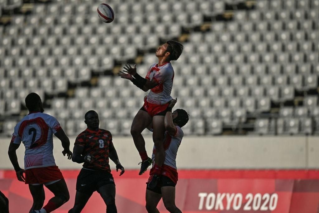 Japan's Ryota Kano (top) wins the ball in the men's placing 9-12 rugby sevens match between Kenya and Japan during the Tokyo 2020 Olympic Games at the Tokyo Stadium in Tokyo on July 27, 2021. (Photo by Ben STANSALL / AFP) (Photo by BEN STANSALL/AFP via...