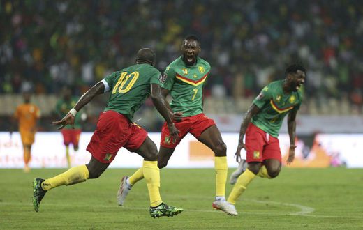 Cameroon forward Karl Toko Ekambi (C) celebrates after scoring the goal that beat the Ivory Coast on Tuesday in a World Cup qualifier in Yaounde