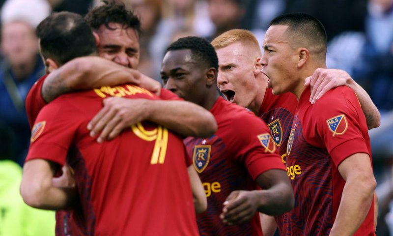 Real Salt Lake's Bobby Wood is congratulated by teammates after scoring the injury-time winner in a 2-1 MLS Cup playoff win over Sporting Kansas City