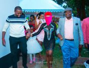 Tanya is ushered by her father (right) towards her surprise birthday gift.