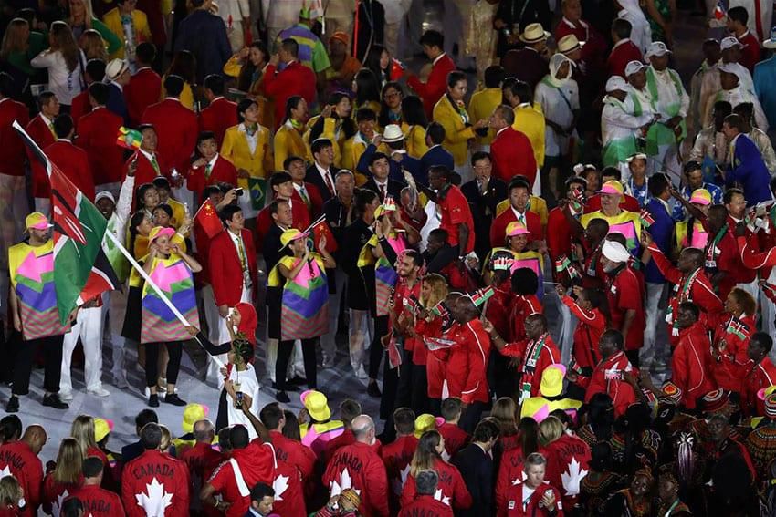 Kenya's flag bearer Shehzana Anwar leads her national delegation during the opening ceremony of the Rio 2016 Olympic Games at the Maracana stadium in Rio de Janeiro on August 5, 2016. / AFP / FRANCK FIFE (Photo credit should read FRANCK FIFE/AFP via Ge...