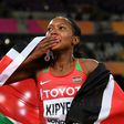 Kenya's Faith Kipyegon celebrates after winning the final of the women's 1,500m at the 2017 IAAF World Championships in London on August 7, 2017