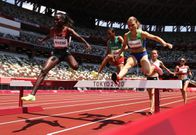 TOKYO, JAPAN - AUGUST 01: Hyvin Kiyeng of Team Kenya and Marusa Mismas-Zrimsek of Team Slovenia compete in round one of the Women's 3000m Steeplechase heats on day nine of the Tokyo 2020 Olympic Games at Olympic Stadium on August 01, 2021 in Tokyo, Japan. (Photo by Cameron Spencer/Getty Images)