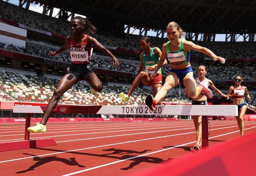 TOKYO, JAPAN - AUGUST 01: Hyvin Kiyeng of Team Kenya and Marusa Mismas-Zrimsek of Team Slovenia compete in round one of the Women's 3000m Steeplechase heats on day nine of the Tokyo 2020 Olympic Games at Olympic Stadium on August 01, 2021 in Tokyo, Japan. (Photo by Cameron Spencer/Getty Images)
