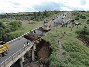 A collapsing bridge and onlookers in Kenya
