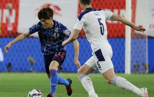 Japan star Kyogo Furuhashi (L)
