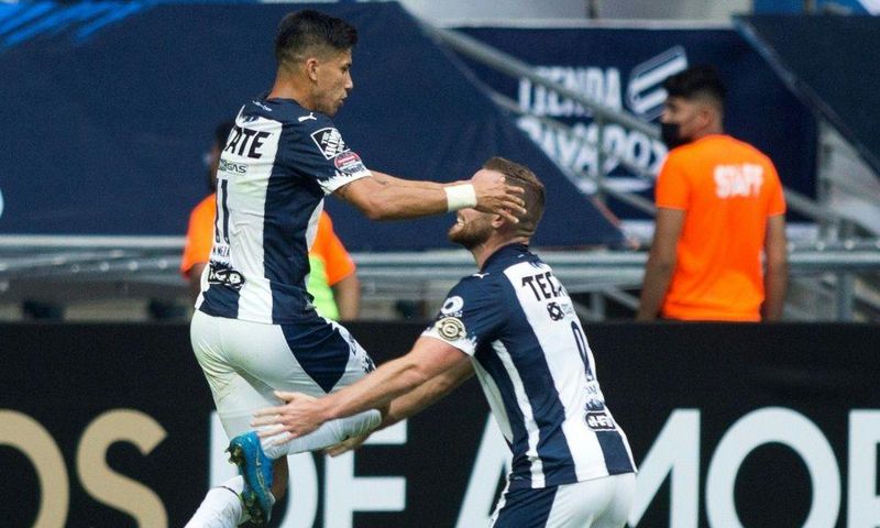 Maximiliano Meza of Mexico's Monterrey celebrates with a teammate after scoring against US club Columbus Crew in a CONCACAF Champions League quarter-final victory