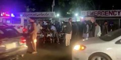 People outside a hospital after an attack at Kabul airport, in Kabul, Afghanistan on August 26.