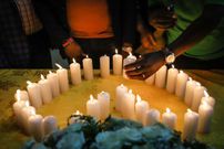 Relatives of Kenyan victims, who perished among the 157 passengers and crew onboard the Ethiopian Airlines operated Boeing 737 MAX 8 aircraft, light candles during a memorial service at the Kenyan Embassy in Addis Ababa, on March 16, 2019. (Photo by Michael TEWELDE / AFP) (Photo credit should read MICHAEL TEWELDE/AFP via Getty Images)