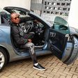 Jalang'o poses inside his Mercedes Benz SLK 200