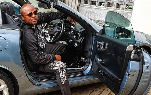Jalang'o poses inside his Mercedes Benz SLK 200