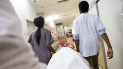 Rushing patient into hospital - stock photo
