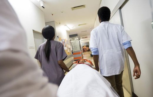 Rushing patient into hospital - stock photo