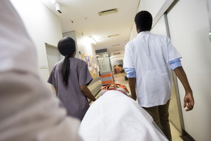 Rushing patient into hospital - stock photo