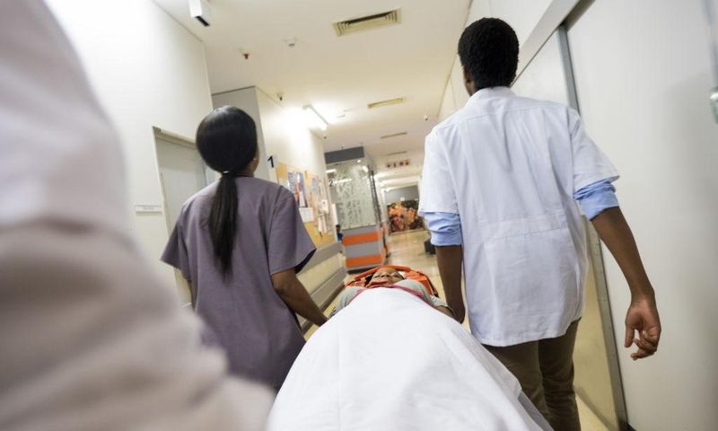 Rushing patient into hospital - stock photo