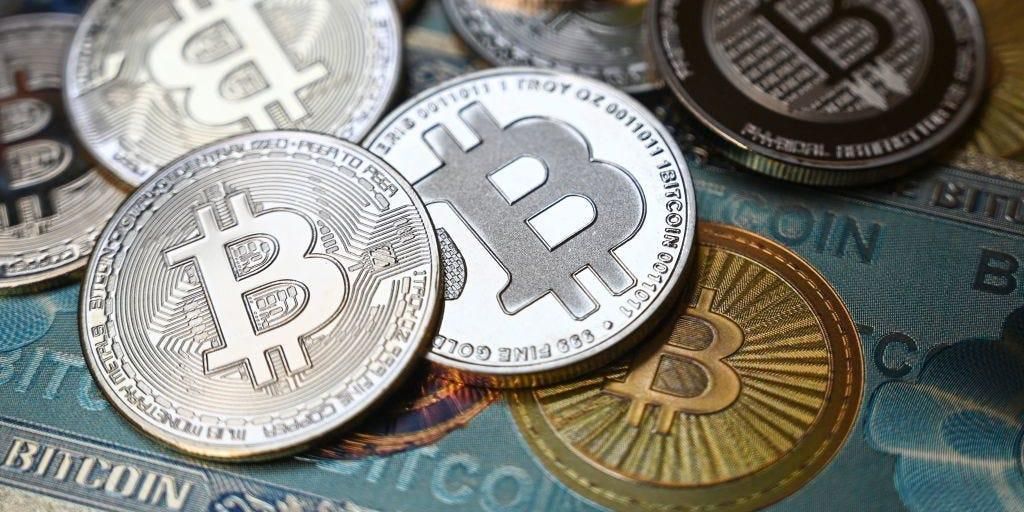 Bitcoin crypto currency physical banknote and coin imitations.