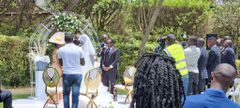 Silas Jakakimba and his bride Florence take vows during their wedding held at the Safari Park Hotel in Nairobi on October 16, 2021