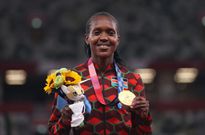 TOKYO, JAPAN - AUGUST 06: Gold medalist Faith Kipyegon of Team Kenya stands on the podium during the medal ceremony for the Women's 1500m on day fourteen of the Tokyo 2020 Olympic Games at Olympic Stadium on August 06, 2021 in Tokyo, Japan. (Photo by Christian Petersen/Getty Images)