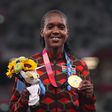 TOKYO, JAPAN - AUGUST 06: Gold medalist Faith Kipyegon of Team Kenya stands on the podium during the medal ceremony for the Women's 1500m on day fourteen of the Tokyo 2020 Olympic Games at Olympic Stadium on August 06, 2021 in Tokyo, Japan. (Photo by C...