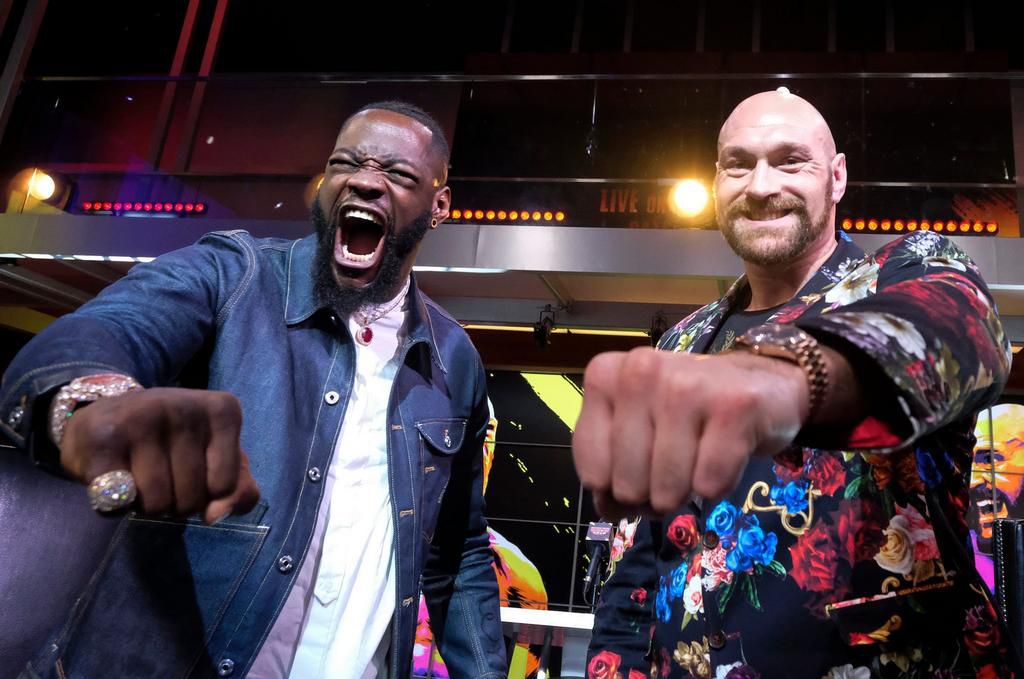 American boxer Deontay Wilder in the ring with British boxer Tyson Fury