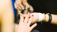 19. Having a manicure.