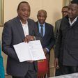 President Uhuru Kenyatta with his legal team including Evans Monari (back right)