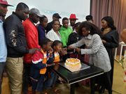 The cast of Papa Shirandula celebrating the death anniversary of Charles Bukeko