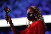 A member of Kenya's delegation waves a national flag as she enters the Olympic Stadium during Tokyo 2020 Olympic Games opening ceremony's parade of athletes, in Tokyo on July 23, 2021. (Photo by HANNAH MCKAY / POOL / AFP) (Photo by HANNAH MCKAY/POOL/AFP via Getty Images)