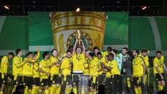 Erling Braut Haaland lifts the trophy after Dortmund won the German Cup final on Thursday