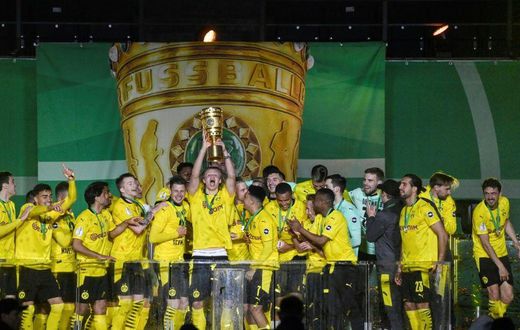 Erling Braut Haaland lifts the trophy after Dortmund won the German Cup final on Thursday